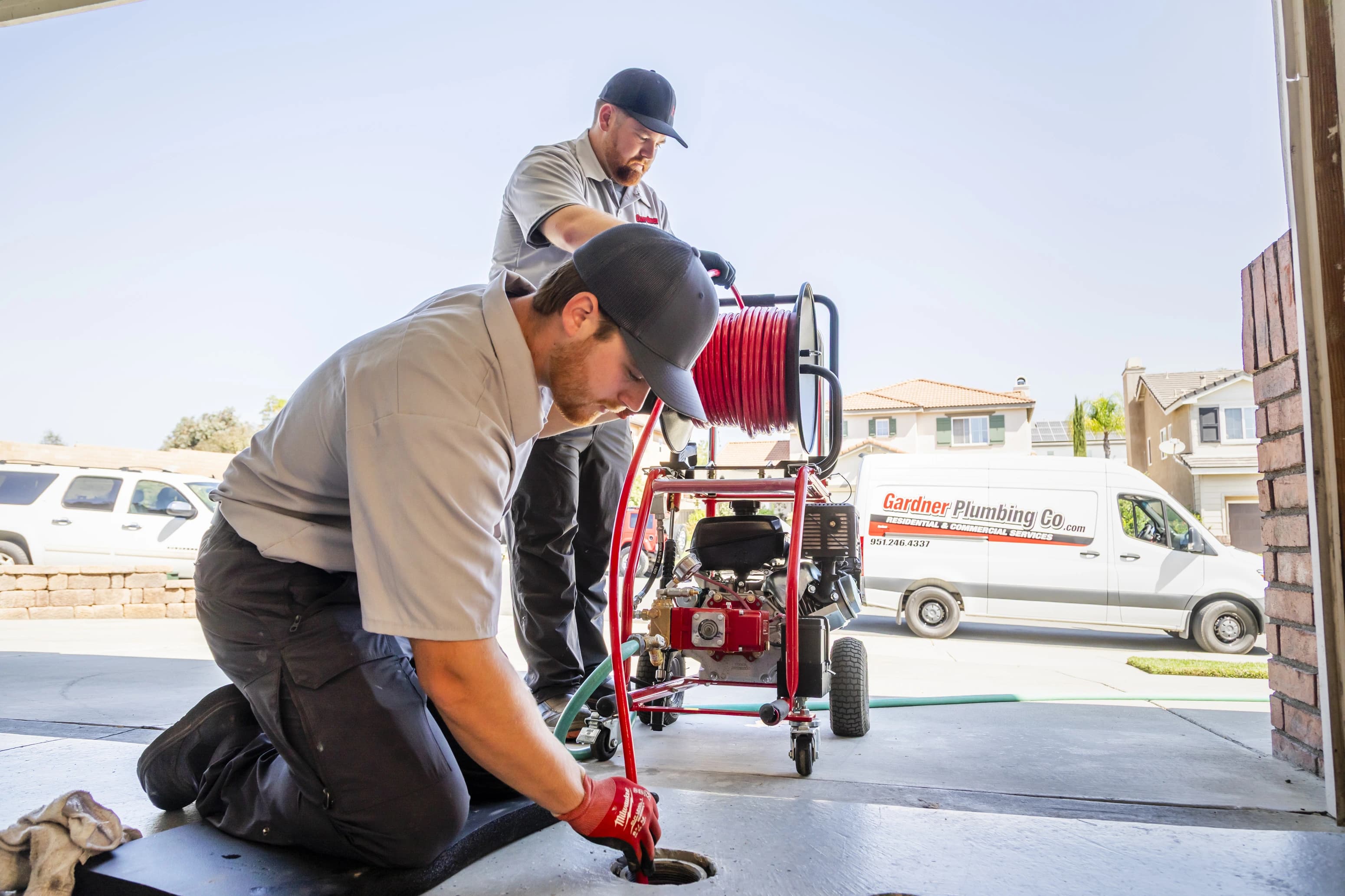 Gardner Plumbing Co. hydro-jetting service clearing a residential drain line with high-pressure water