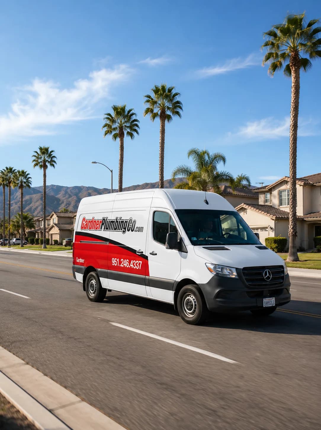 Gardner Plumbing Co. service van driving through a Southern California residential neighborhood serving 25 cities across Riverside County and the Coachella Valley